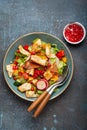 Traditional Levant dish Fattoush salad, Arab cuisine, made with pita bread croutons, vegetables and herbs. Healthy