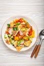 Traditional Levant dish Fattoush salad, Arab cuisine, with pita bread croutons, vegetables, herbs. Healthy Middle