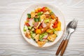 Traditional Levant dish Fattoush salad, Arab cuisine, with pita bread croutons, vegetables, herbs. Healthy Middle