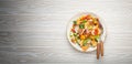 Traditional Levant dish Fattoush salad, Arab cuisine, with pita bread croutons, vegetables, herbs. Healthy Middle