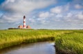 Traditional lighthouse with beautiful landscape at North Sea Royalty Free Stock Photo