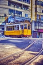 Traditional Lisbon Yellow Tram on Street of Alfama District in Portugal Royalty Free Stock Photo