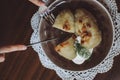 Traditional Lithuanian dish of stuffed potato dumplings cepelinai. The dumplings are made from grated and riced potatoes and Royalty Free Stock Photo