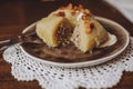 Traditional Lithuanian dish of stuffed potato dumplings cepelinai Royalty Free Stock Photo