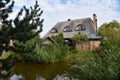 Traditional Lithuanian manor with garden pond Royalty Free Stock Photo