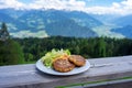 traditional local kaspressknodel cheese dumpling in tirol austria with mountain view landscape Royalty Free Stock Photo