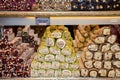 Traditional lokum rolls a sweet dessert turkish delights, pastry with different flavours and fillings: pistachios, walnut. Fre Royalty Free Stock Photo