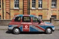 Traditional London Taxi Covered With Vodafone Advertising