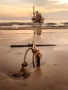 Traditional long tail boat with anchor in sand, Thailand