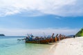 Traditional long tail boats in crystal clear water in Sai Khao Beach, Ra Wi Island, Southern of Thailand