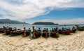 Traditional long tail tourist boats park in beautiful Sai Khao Beach, Ra Wi Island, Southern of Thailand