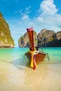 Traditional Longtail Boat Tied to a Tropical Beach in Thailand Royalty Free Stock Photo