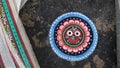 A traditional Lord Jagannath scroll painting, for sale, in a house at art village Raghurajpur, Odisha, India. Pattachitra