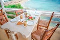 Traditional lunch with delicious fresh greek salad, frappe and brusketa served for lunch at outdoor cafe Royalty Free Stock Photo