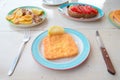 Traditional lunch with delicious fresh greek salad, frappe and fried cheese on the table Royalty Free Stock Photo