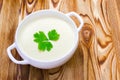 Traditional lunch or dinner with potato and onion vegan, vegetarian healthy cream soup in white ceramic bowl. Tasty potato soup wi Royalty Free Stock Photo