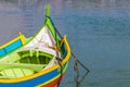 Traditional Luzzu boat at Marsaxlokk harbor in Malta. Royalty Free Stock Photo