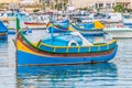 Traditional Luzzu boat at Marsaxlokk harbor in Malta Royalty Free Stock Photo