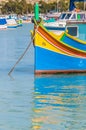 Traditional Luzzu boat at Marsaxlokk harbor in Malta Royalty Free Stock Photo