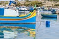 Traditional Luzzu boat at Marsaxlokk harbor in Malta Royalty Free Stock Photo