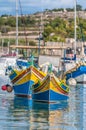 Traditional Luzzu boat at Marsaxlokk harbor in Malta. Royalty Free Stock Photo