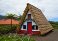 Traditional Madeira building with thatched roof.