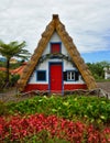 Traditional Madeira building with thatched roof.