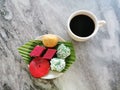 Traditional Malaysian dessert or kuih-muih served with coffee on the table. Royalty Free Stock Photo