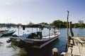 Traditional malaysian fisherman boat moored, wooden jetty and bl Royalty Free Stock Photo