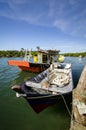 Traditional malaysian fisherman boat moored, wooden jetty and bl Royalty Free Stock Photo