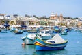 Fishing boats moored in Marsaxlokk harbour, Malta. Royalty Free Stock Photo