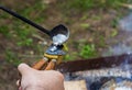 Traditional manual metal casting process to form aluminum tin press bullets Royalty Free Stock Photo