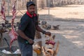 Traditional Market Scene in Opuwo Man Butchering Meat