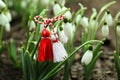 Traditional martisor and fresh snowdrop flowers outdoors