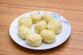 Traditional matzoh ball kneidlach for soup.White platel with authentic matzo ball tradition Jewish food for Passover .