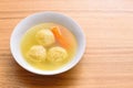 Traditional matzoh ball soup.White bowl with authentic matzo ball chicken hot soup tradition Jewish food for Passover.