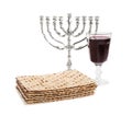 Traditional matzos, red wine and menorah on white background Royalty Free Stock Photo