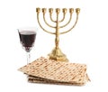 Traditional matzos, red wine and menorah on white background Royalty Free Stock Photo