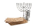 Traditional matzos, wine and menorah on white background Royalty Free Stock Photo