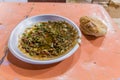 Traditional meal in Sudan - fuul (stew of cooked fava beans) and brea Royalty Free Stock Photo