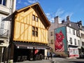 Traditional medieval wooden house near a wall paint at Dijon France