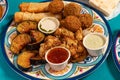 Traditional Mediterranean Arabic hot breakfast of fried vegetables, falafel, cheese rolls and various dips