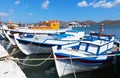 Embankment of Elounda with white-blue fishing boats on Crete Island, Greece