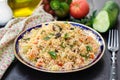 Traditional Mediterranean Levantine salad Tabbouleh with couscous and fresh summer vegetables