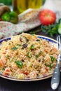 Traditional Mediterranean Levantine salad Tabbouleh with couscous and fresh summer vegetables