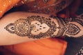 Traditional Mehndi henna pattern on female leg. Close-up photo. Royalty Free Stock Photo