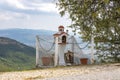Traditional and memorial roadside small chapel altar or shrine on the side of the road in Greece, Meteora region