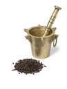 Traditional metal Mortar and pestle with a heap of dried black pepper in front