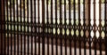 Traditional metallic grills of a locked security gate of a building