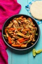 Mexican chicken fajitas on turquoise background Royalty Free Stock Photo